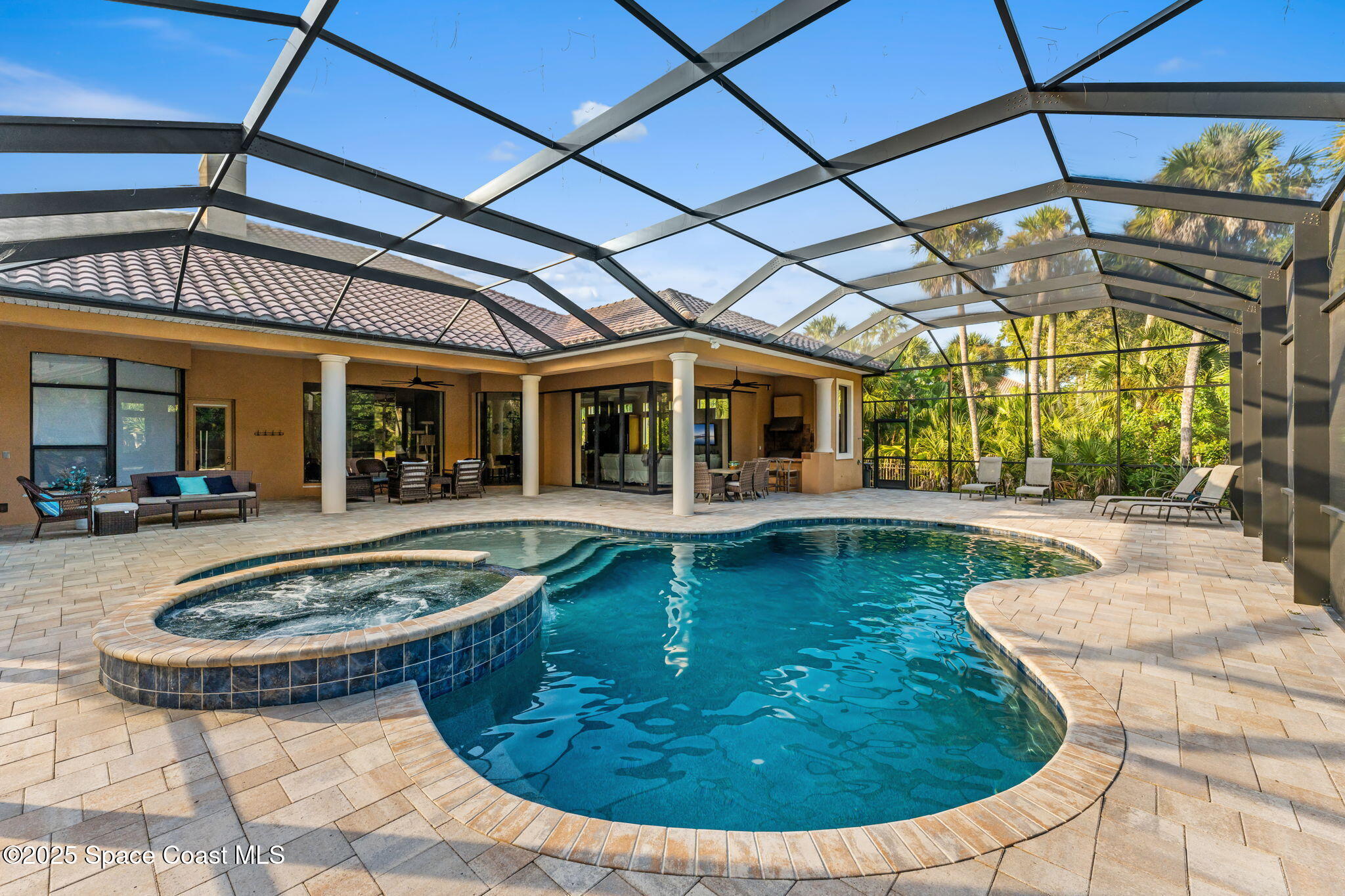4447 Reseda Way Rockledge, FL 32955 - Photo 67 of 87 a view of a swimming pool with a patio
