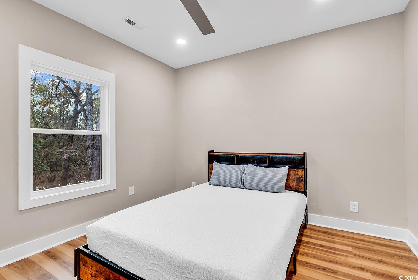 32 Old Place Kingstree, SC 29556 - Photo 11 of 40 Bedroom featuring light wood-type flooring, ceiling fan, and recessed lighting