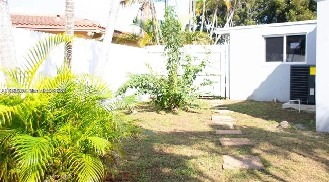 a view of a yard with plants