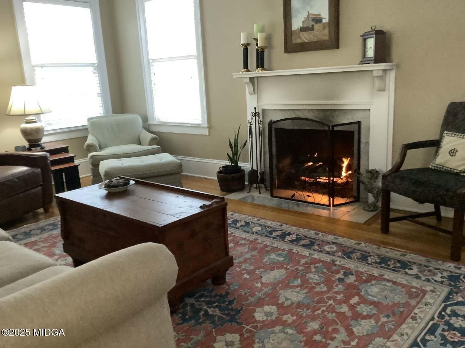1057 Bond Street Macon, GA 31201 - Photo 18 of 27 a living room with furniture and a fireplace