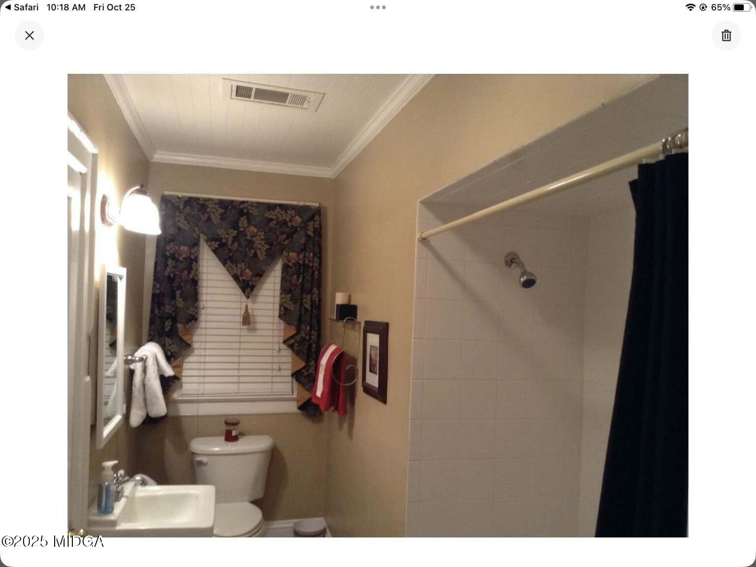 1057 Bond Street Macon, GA 31201 - Photo 19 of 27 a bathroom with a sink and mirror