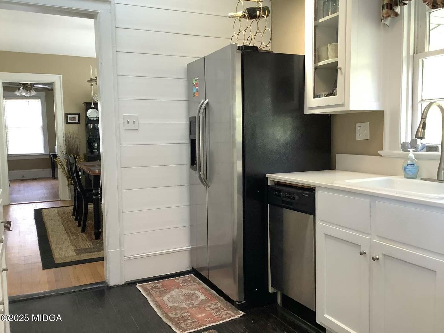 1057 Bond Street Macon, GA 31201 - Photo 26 of 27 a kitchen with a refrigerator and countertop
