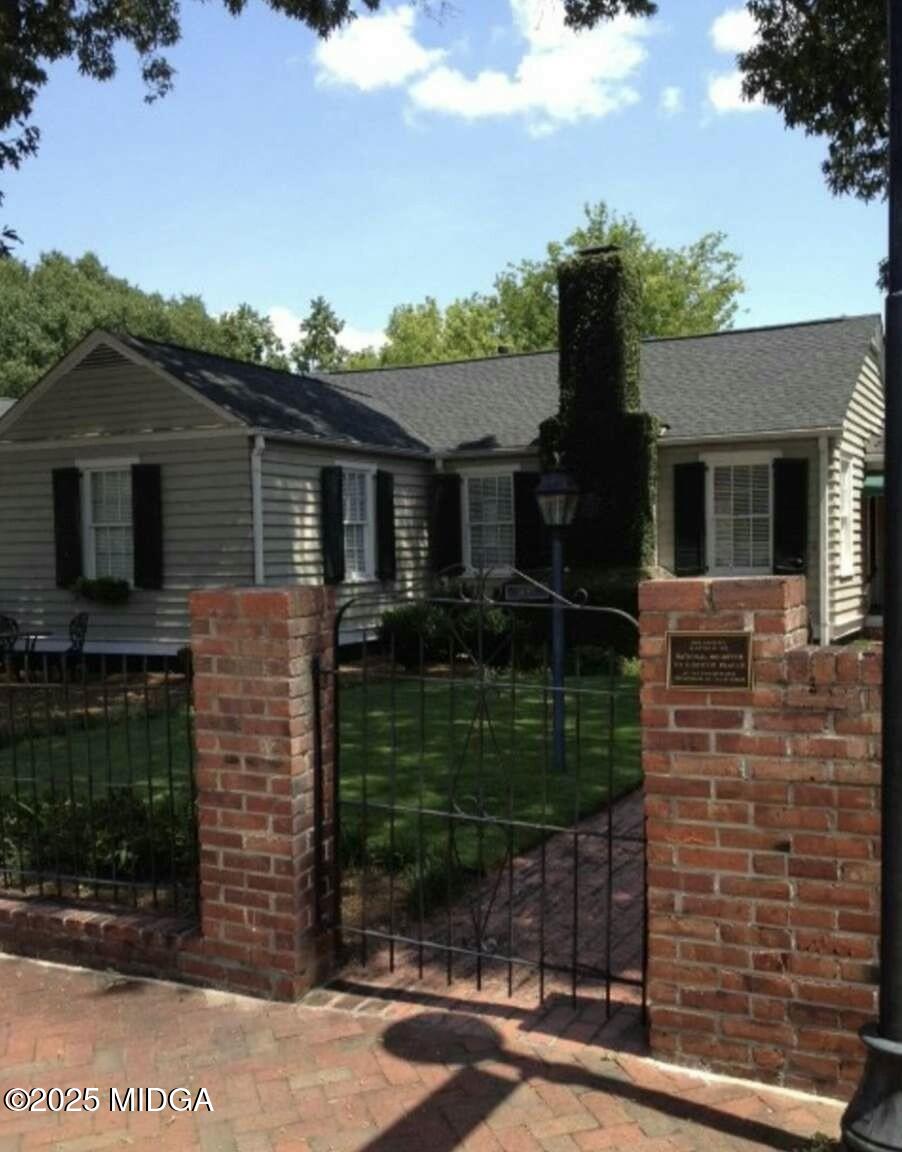 1057 Bond Street Macon, GA 31201 - Photo 4 of 27 front view of house with a yard
