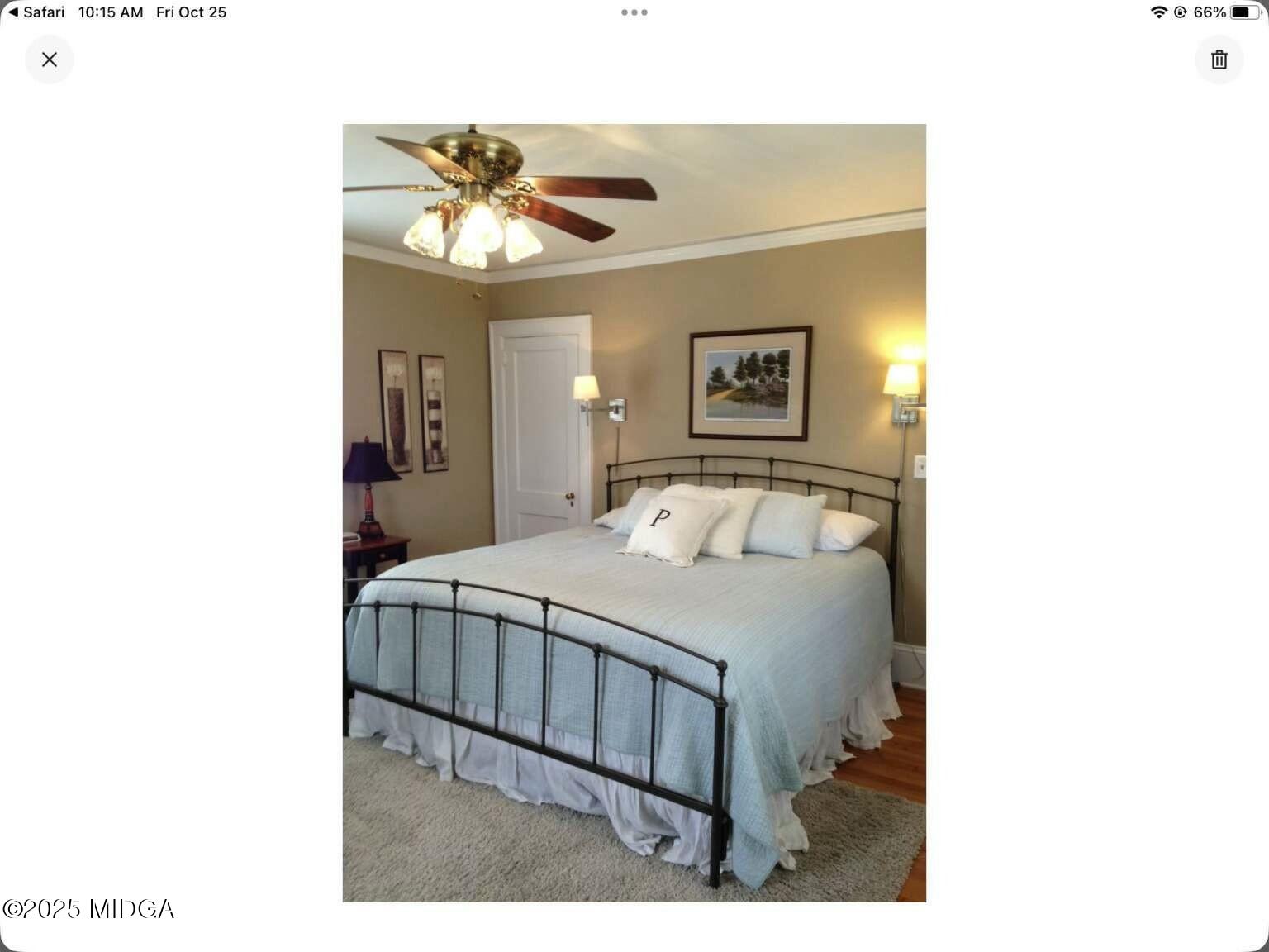 1057 Bond Street Macon, GA 31201 - Photo 5 of 27 a bedroom with a bed and a chandelier