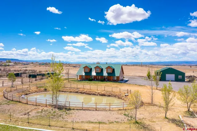 a view of a swimming pool with an outdoor space and seating area