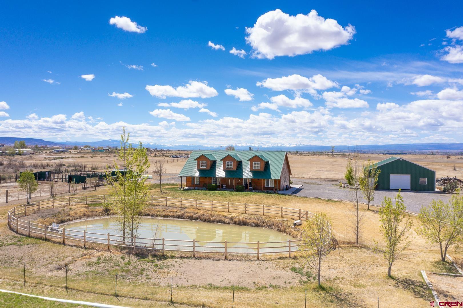 a view of a swimming pool with an outdoor space and seating area