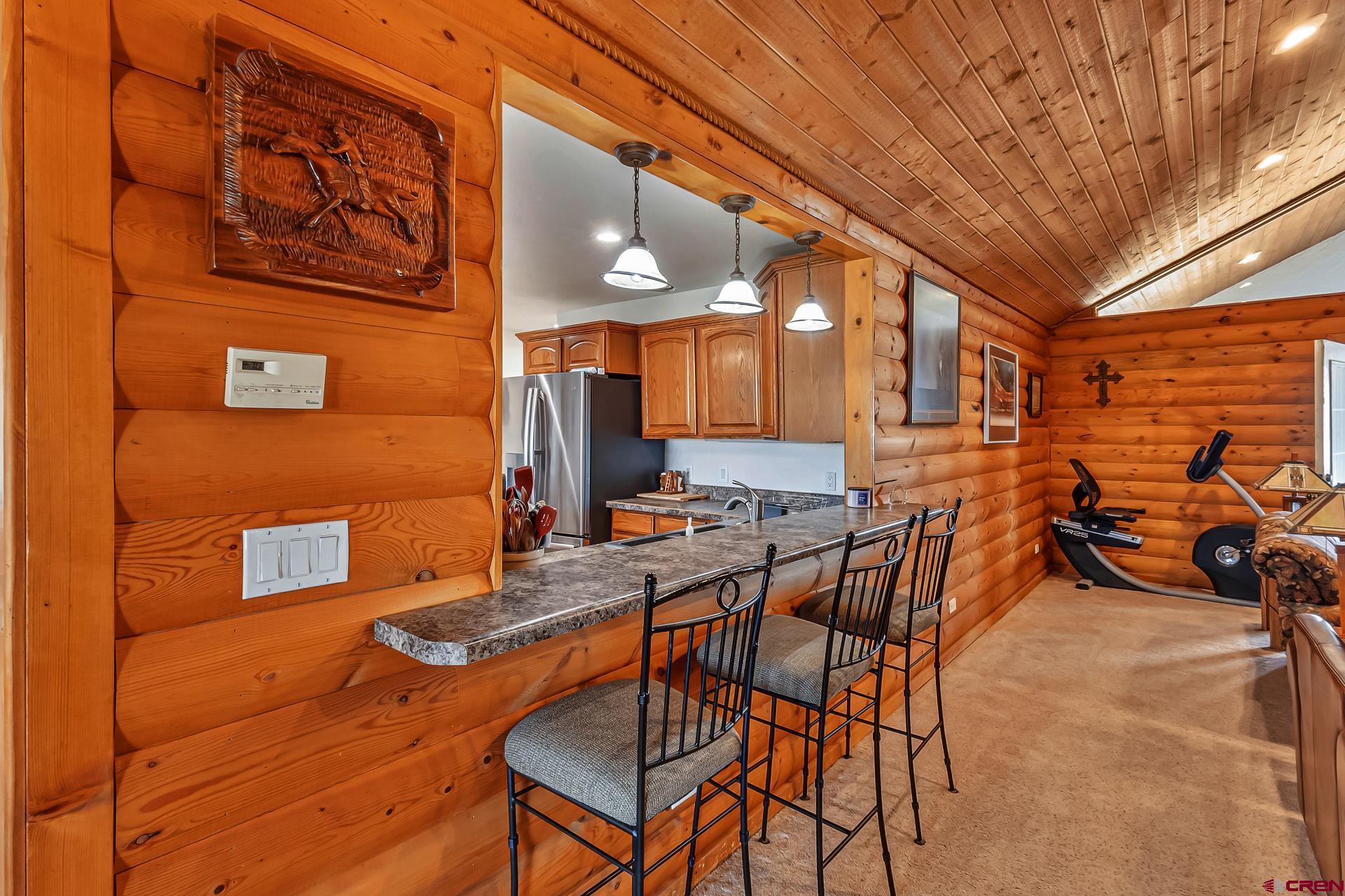 19632 E Road Delta, CO 81416 - Photo 13 of 45 a view of a patio with table and chairs with wooden floor and fence