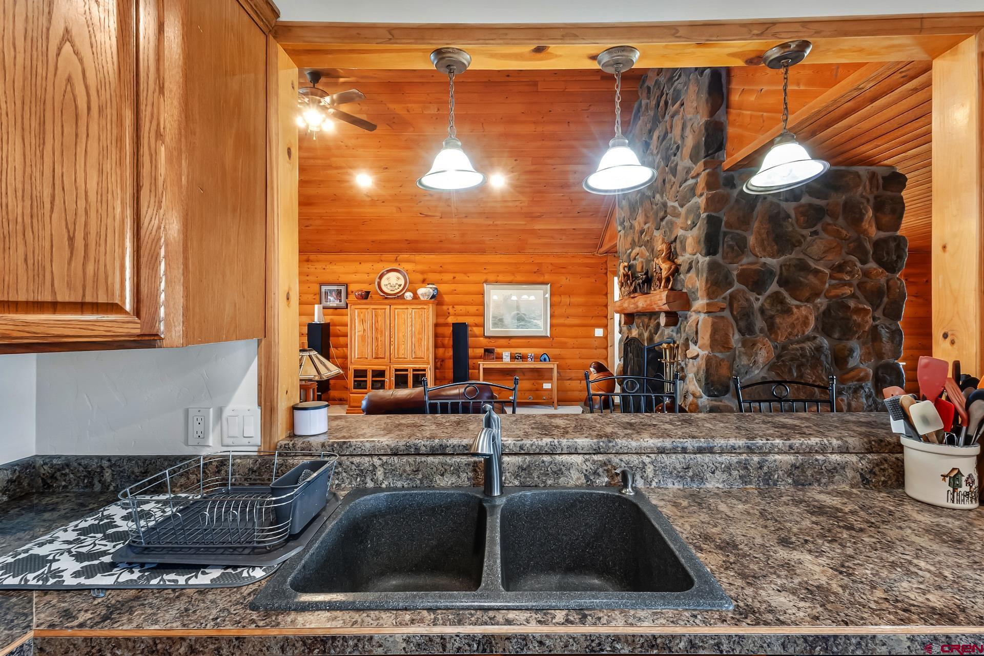 19632 E Road Delta, CO 81416 - Photo 14 of 45 a kitchen with a sink and a cabinets