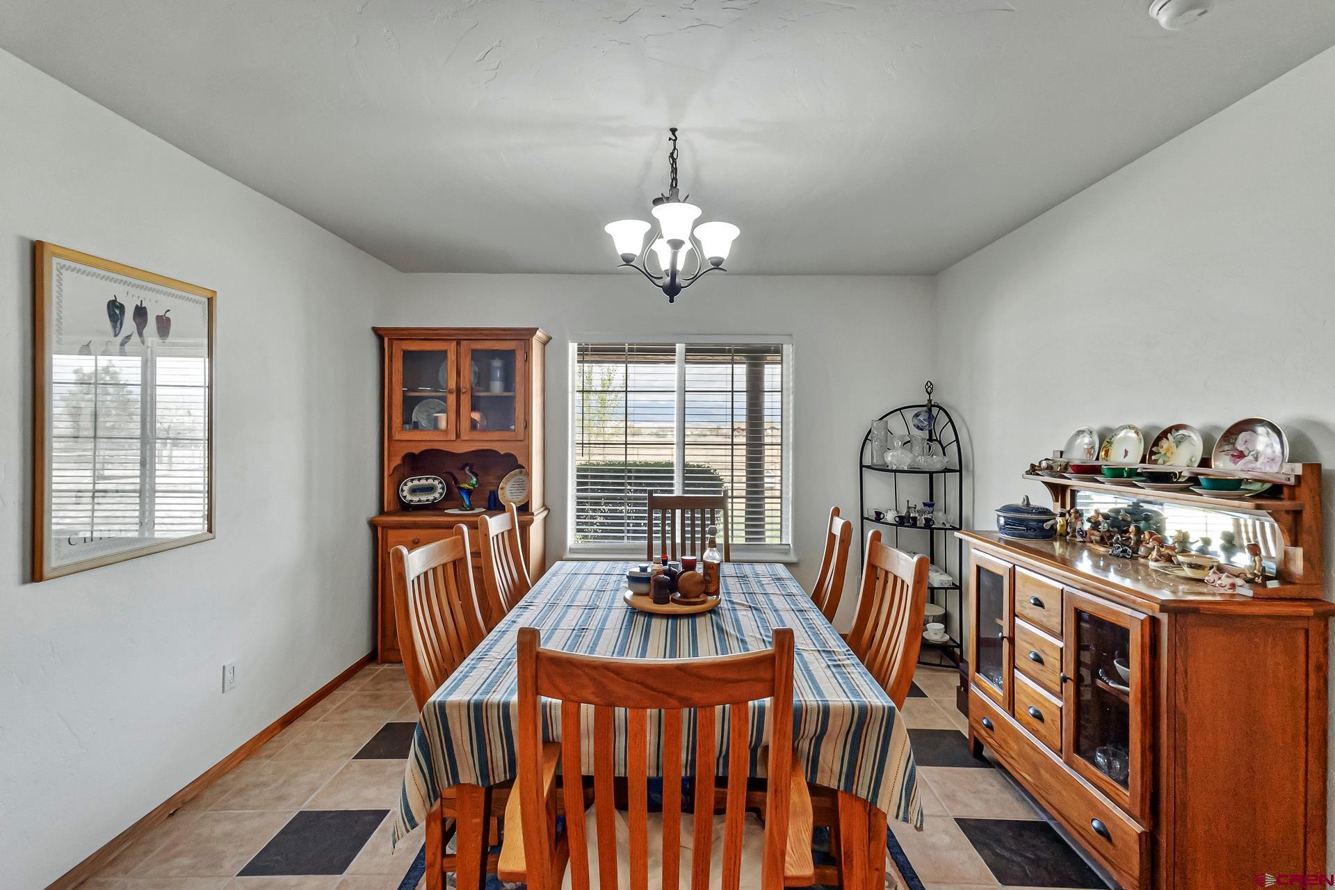 19632 E Road Delta, CO 81416 - Photo 19 of 45 a view of a dining room with furniture window and outside view