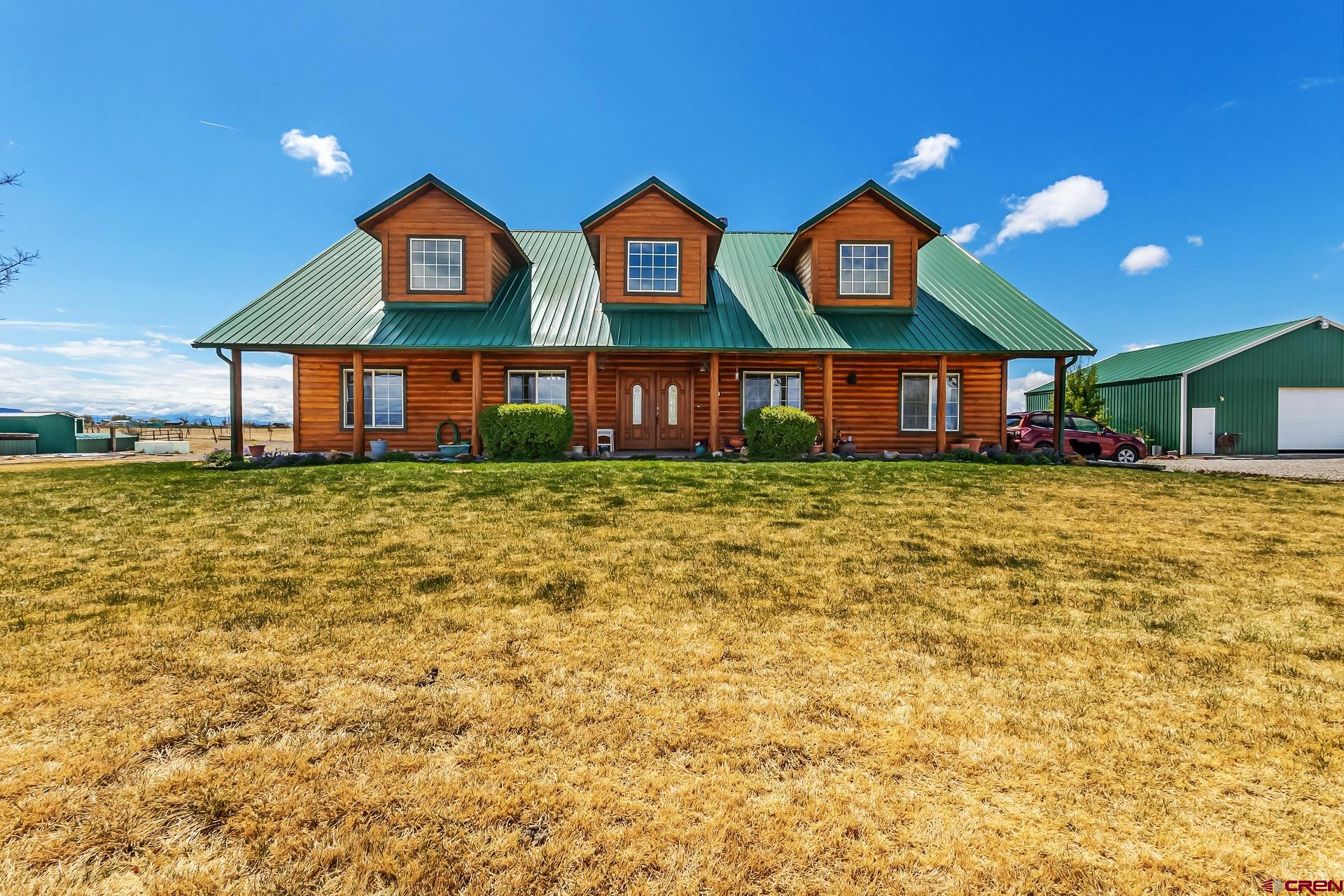 19632 E Road Delta, CO 81416 - Photo 2 of 45 a view of a building with a swimming pool