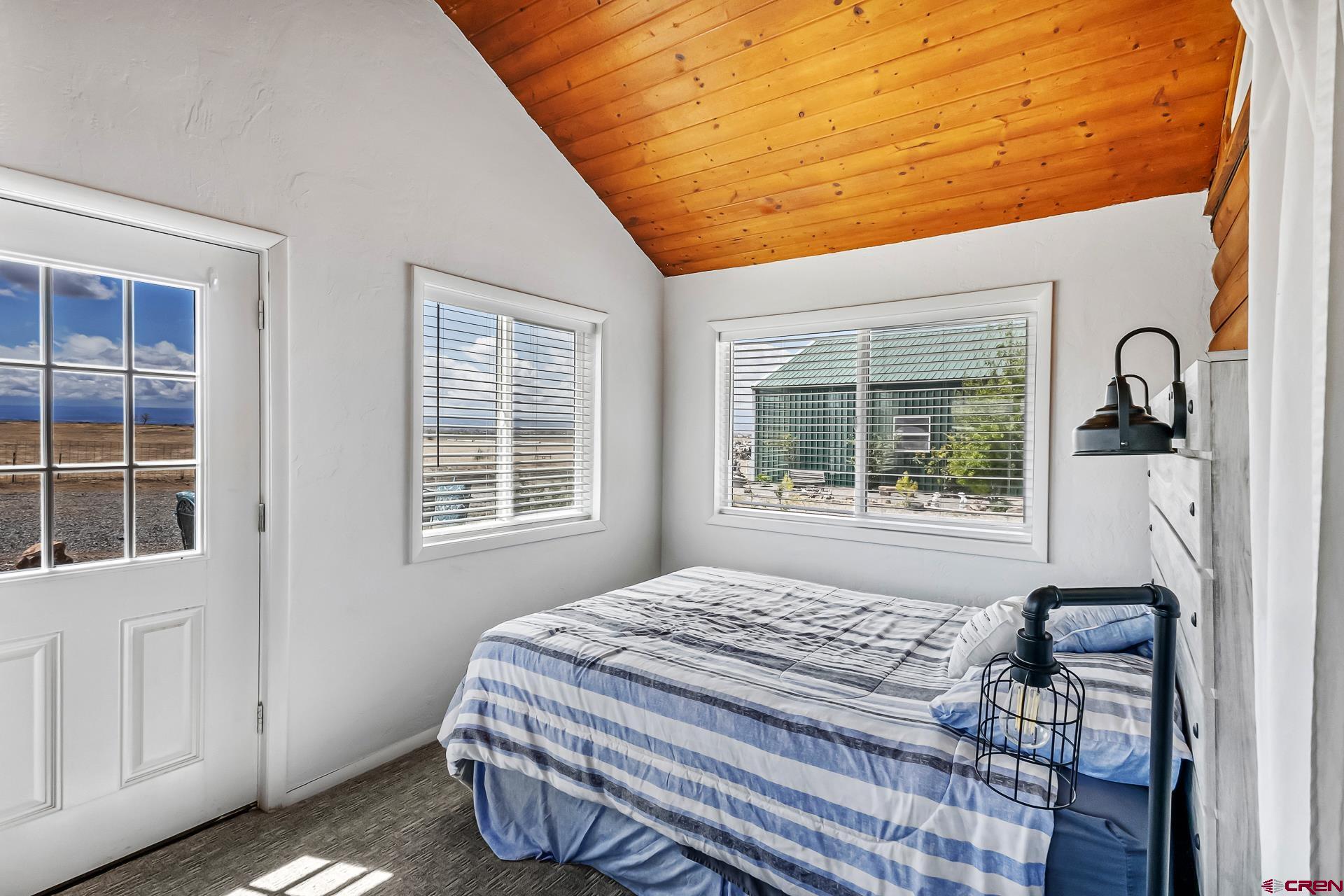 19632 E Road Delta, CO 81416 - Photo 23 of 45 a bedroom with a bed and a window