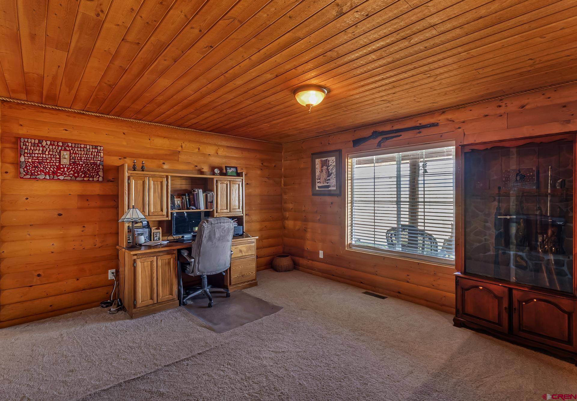 19632 E Road Delta, CO 81416 - Photo 27 of 45 a view of a room with workspace and windows