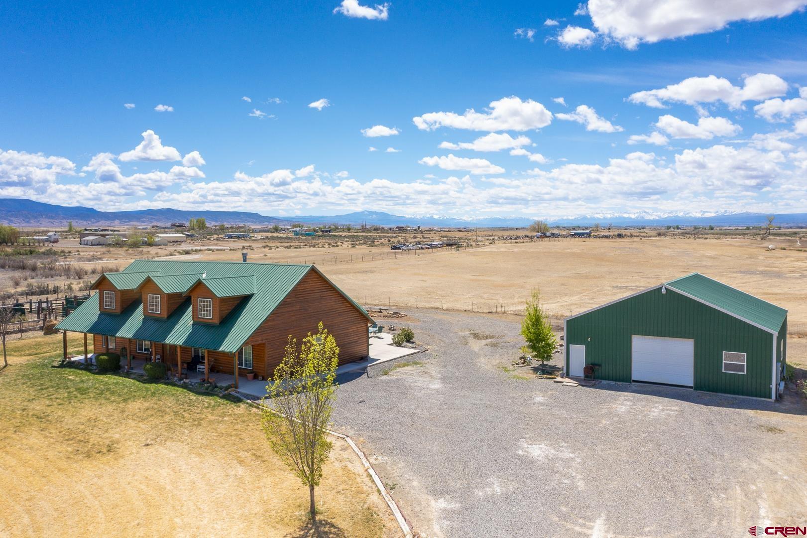 19632 E Road Delta, CO 81416 - Photo 36 of 45 a view of a house with a yard from a fireplace