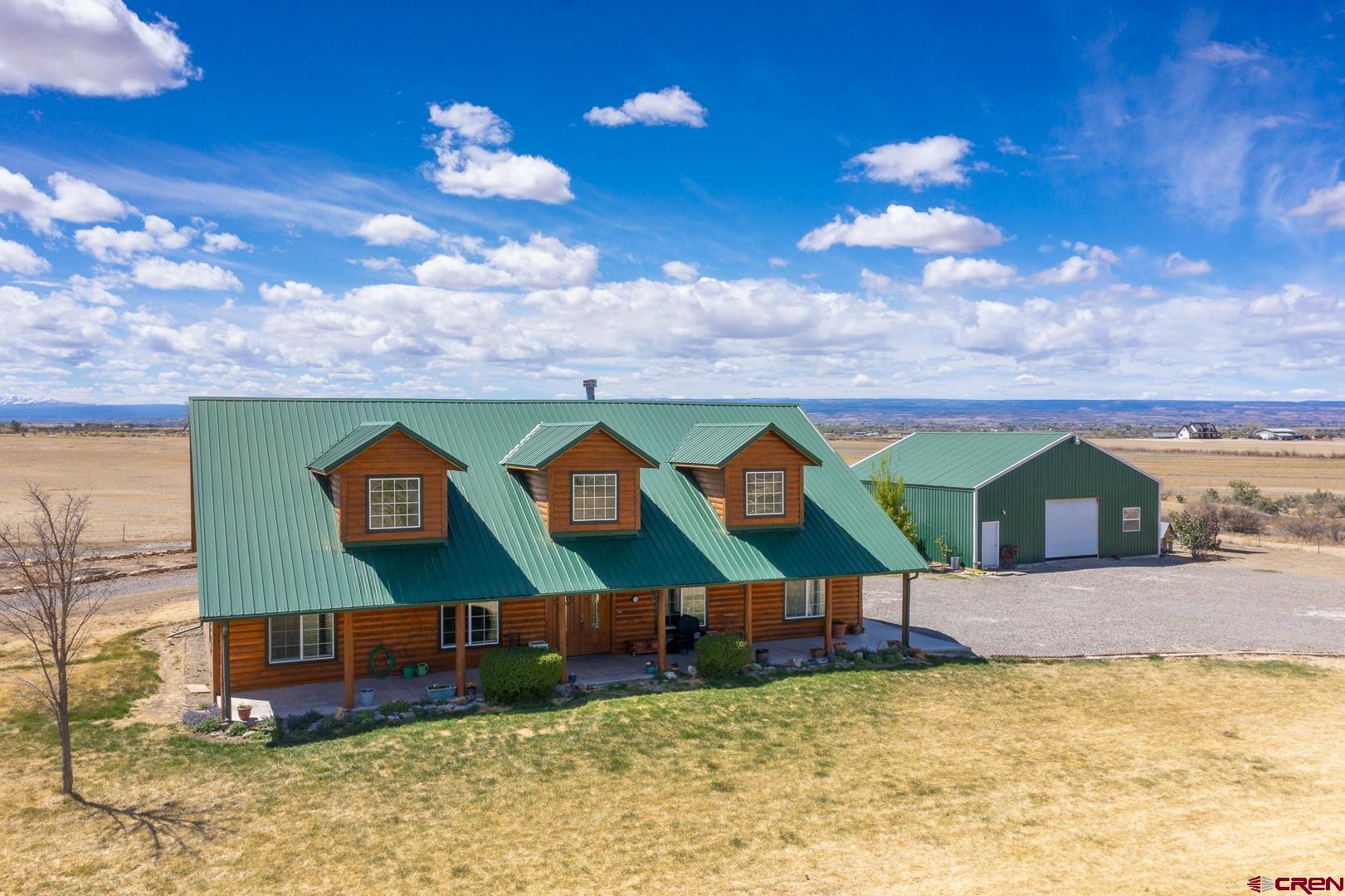 19632 E Road Delta, CO 81416 - Photo 37 of 45 a view of swimming pool with an outdoor space and seating area
