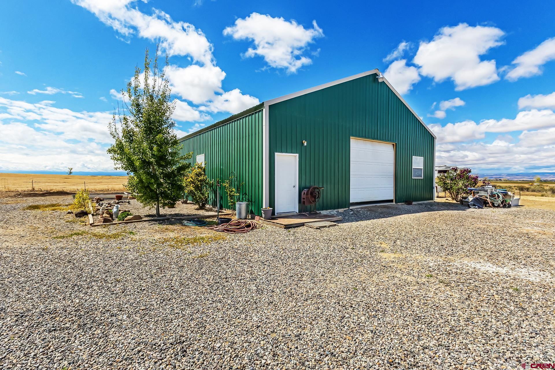 19632 E Road Delta, CO 81416 - Photo 40 of 45 a view of a house with a patio