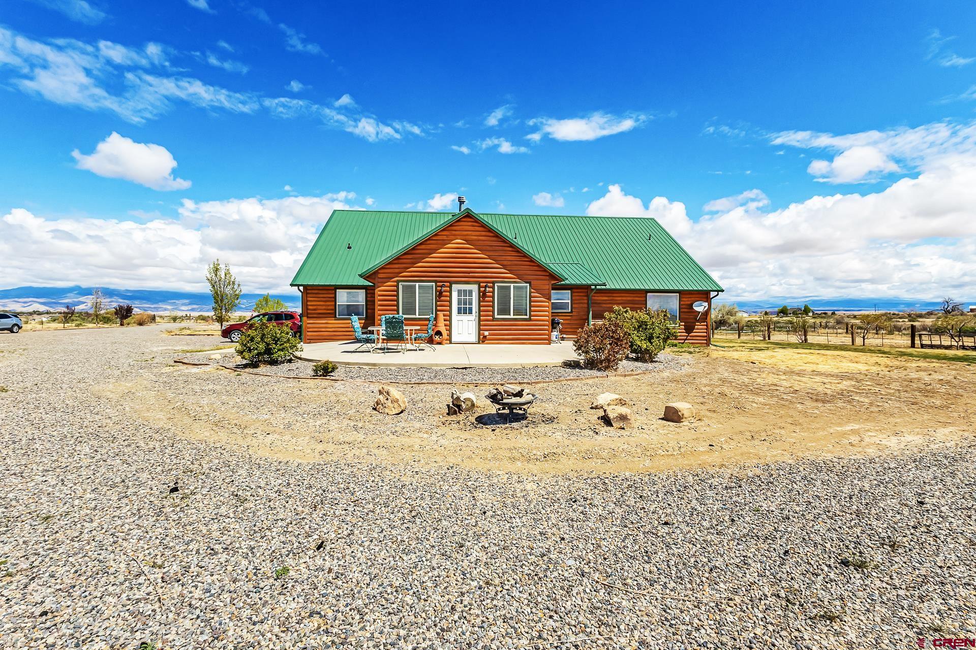 19632 E Road Delta, CO 81416 - Photo 45 of 45 a house with trees in the background