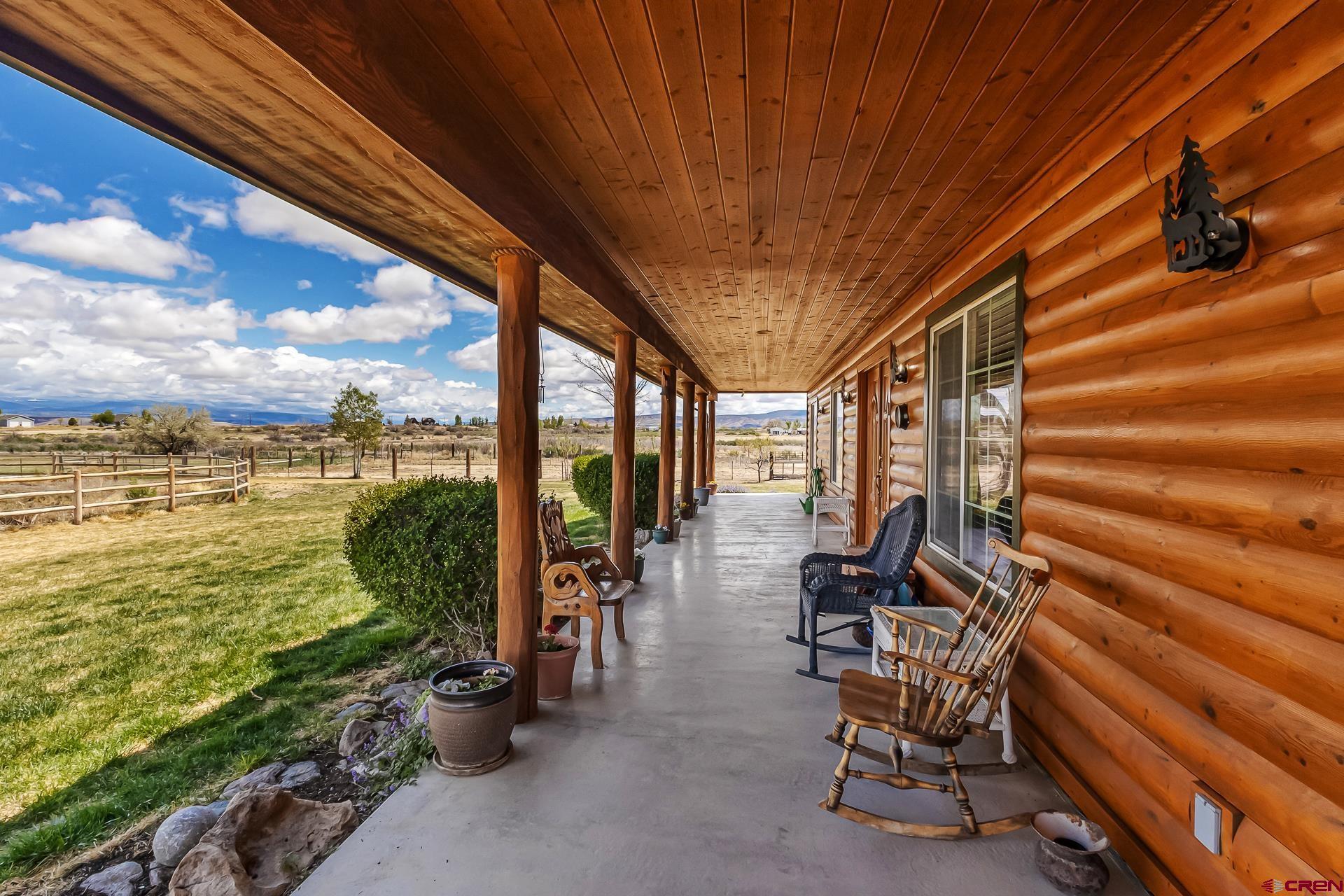 19632 E Road Delta, CO 81416 - Photo 5 of 45 a view of a chairs and table in patio with a lake view