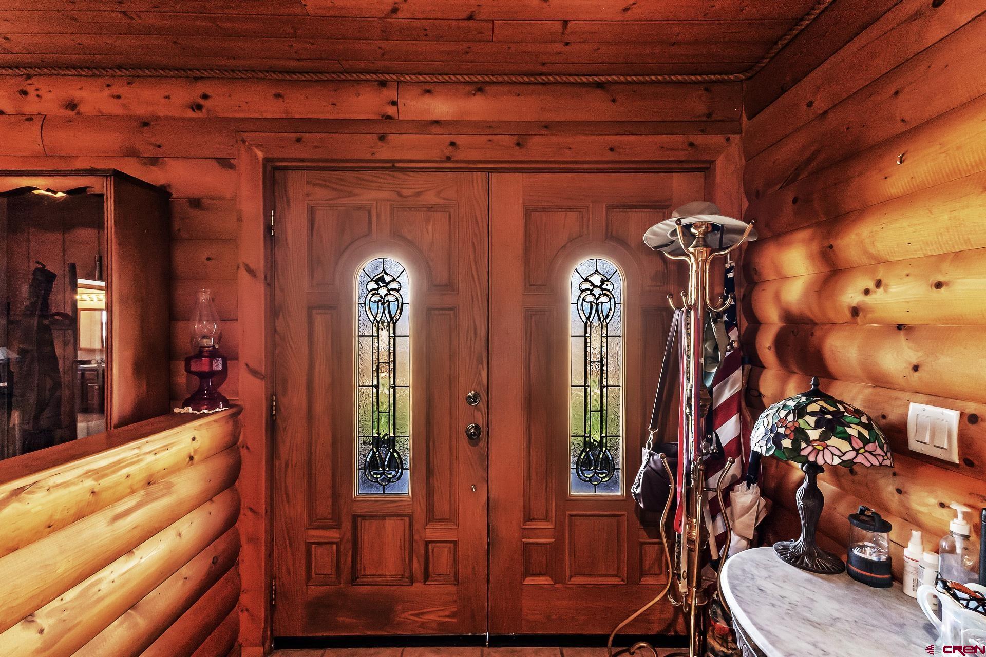 19632 E Road Delta, CO 81416 - Photo 7 of 45 a view of front door of house and living room