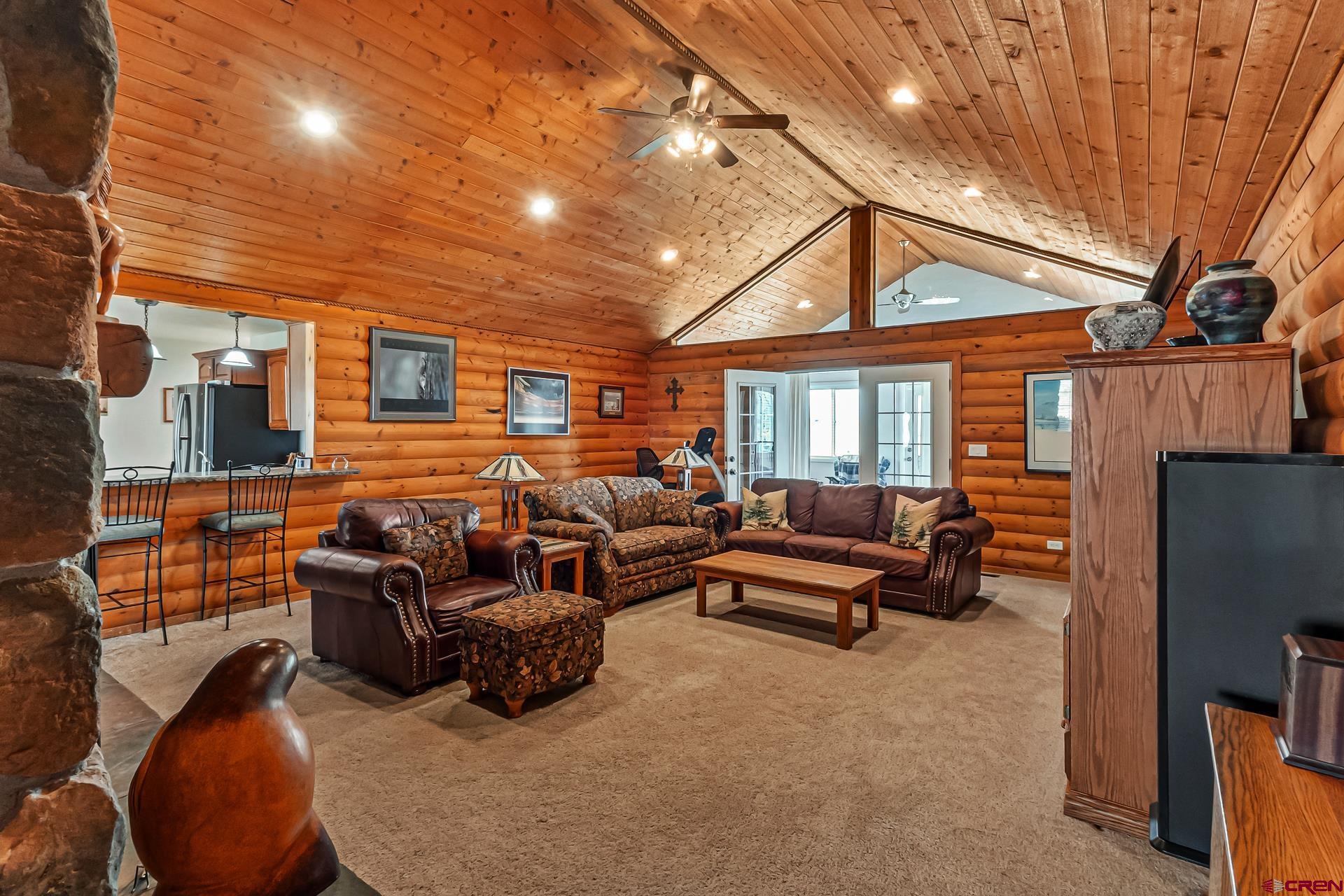 19632 E Road Delta, CO 81416 - Photo 10 of 45 a living room with furniture a couch and a fireplace