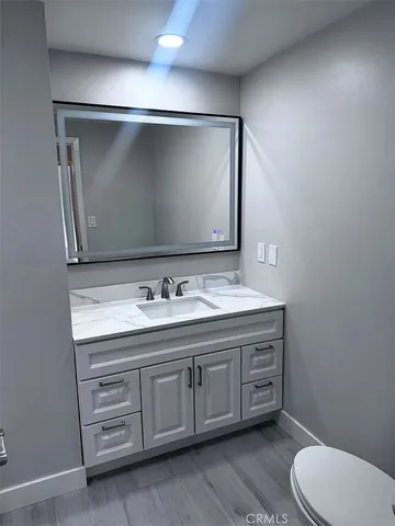 a bathroom with a double vanity sink and mirror