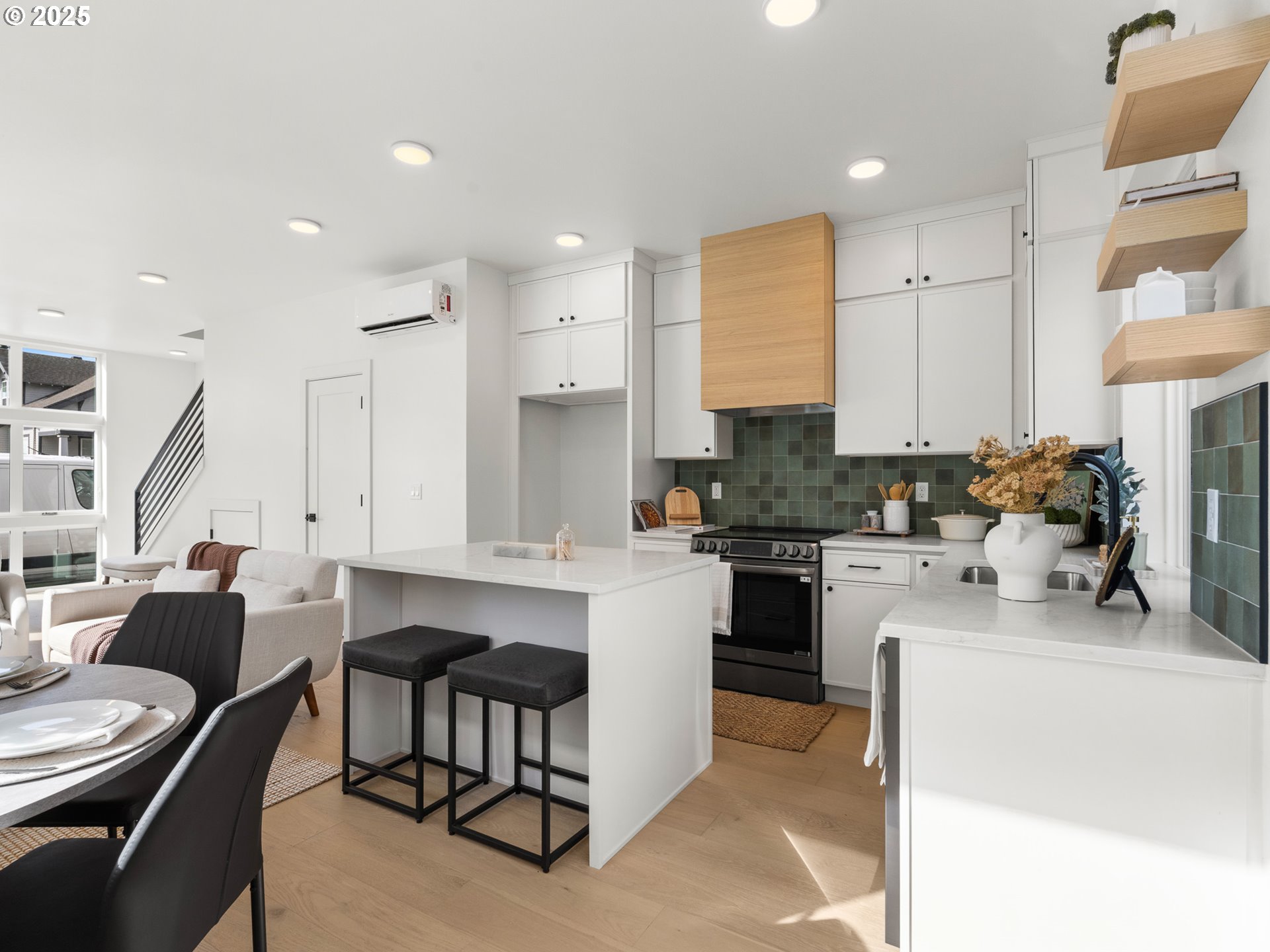 1911 Broadway Street, Unit 1 Vancouver, WA 98663 - Photo 11 of 25 a kitchen with stainless steel appliances kitchen island granite countertop a sink and cabinets