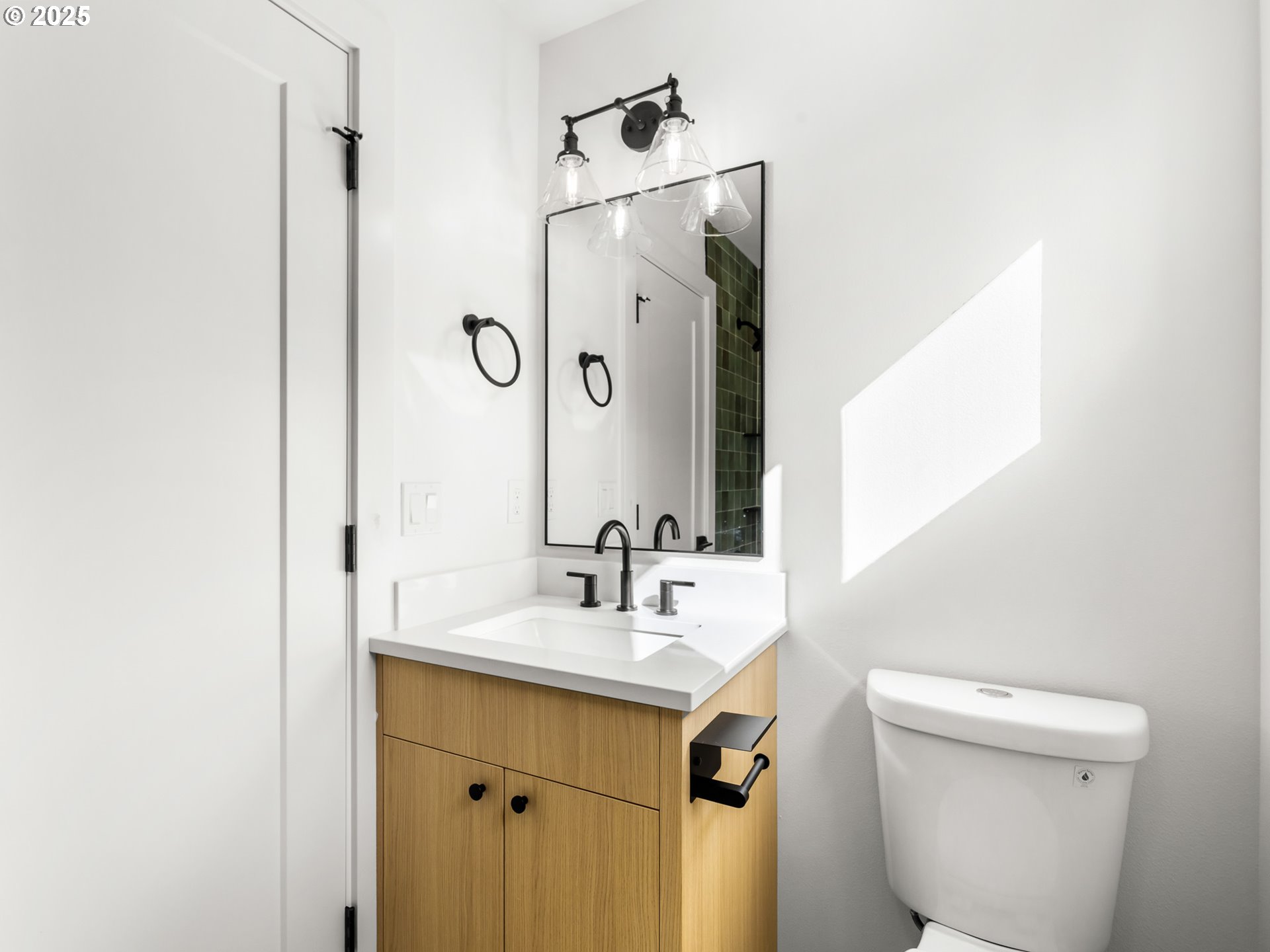 1911 Broadway Street, Unit 1 Vancouver, WA 98663 - Photo 17 of 25 a bathroom with a sink a toilet and mirror