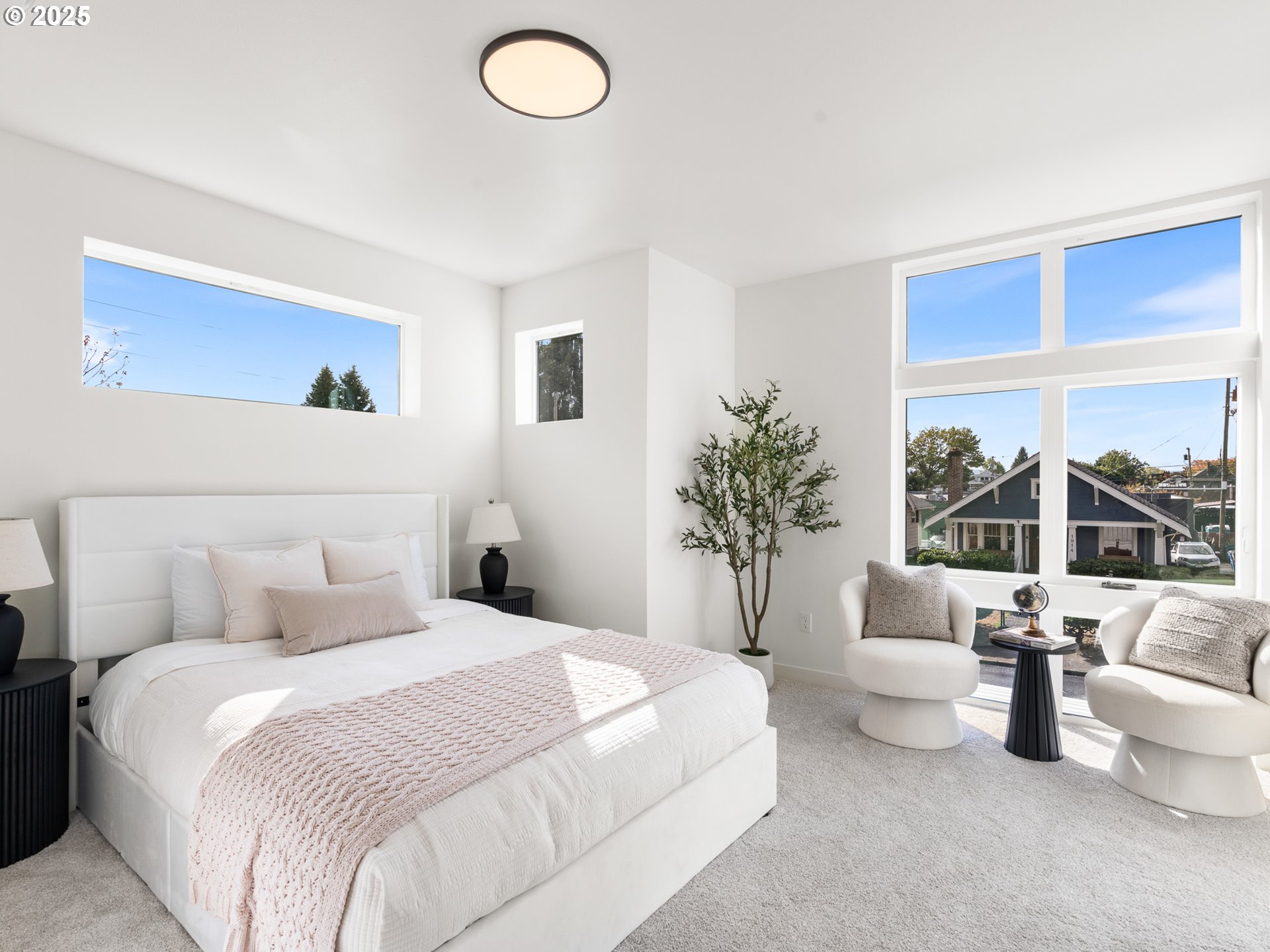 1911 Broadway Street, Unit 1 Vancouver, WA 98663 - Photo 18 of 25 a bedroom with a balcony a bed and a large window