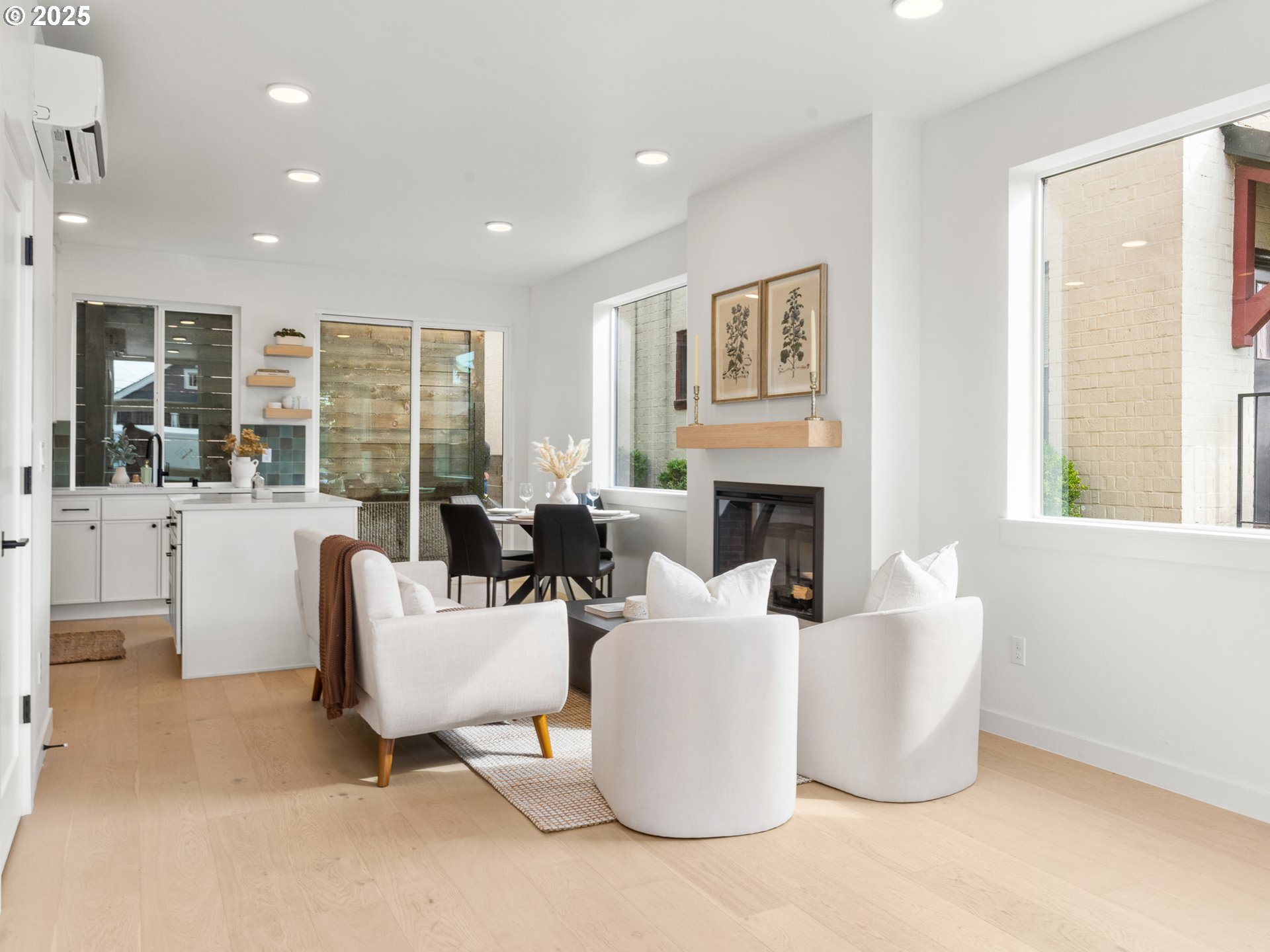 1911 Broadway Street, Unit 1 Vancouver, WA 98663 - Photo 2 of 25 a living room with fireplace furniture and a large window