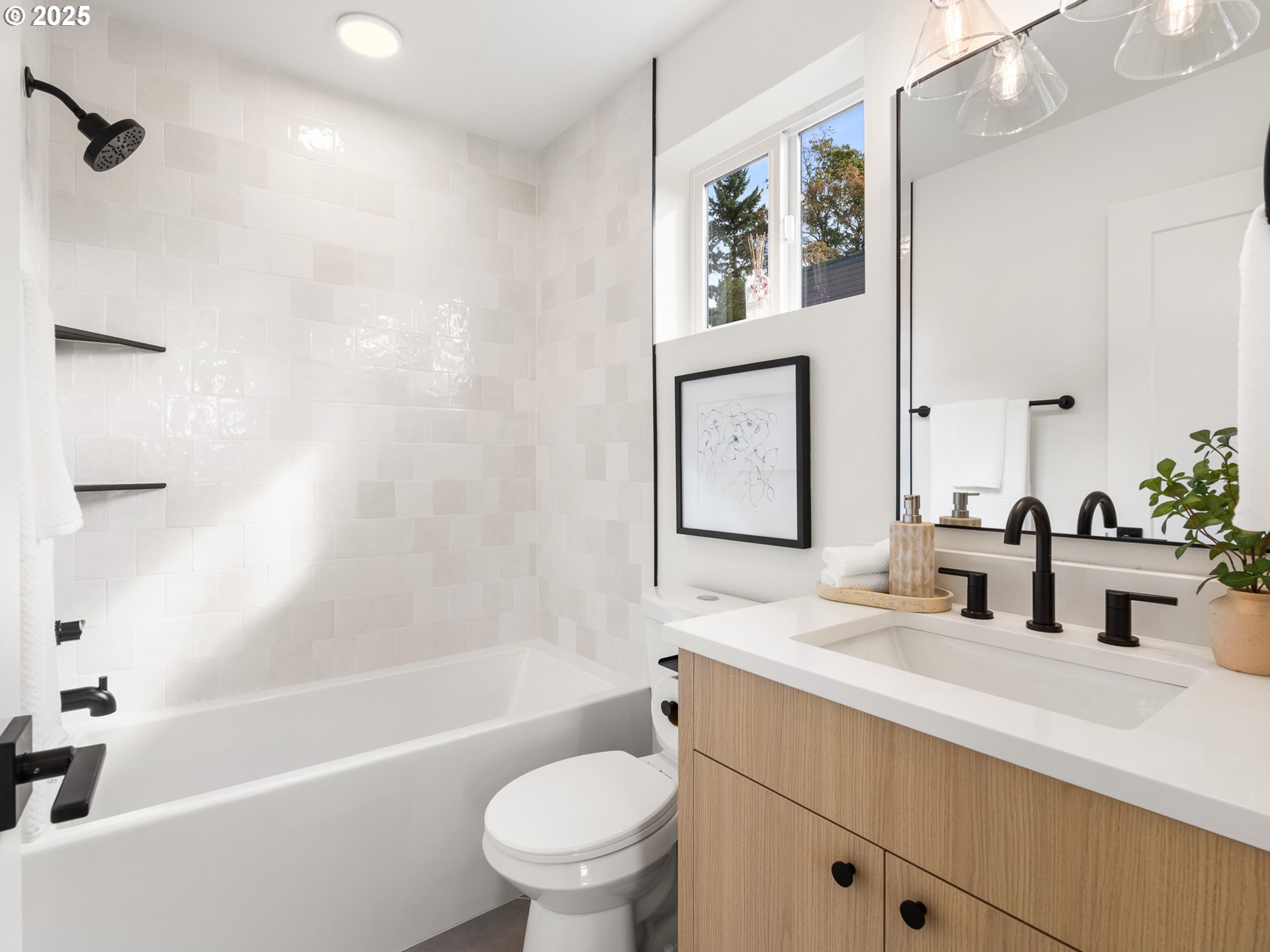 1911 Broadway Street, Unit 1 Vancouver, WA 98663 - Photo 21 of 25 a bathroom with a granite countertop sink a toilet a mirror a bathtub and shower