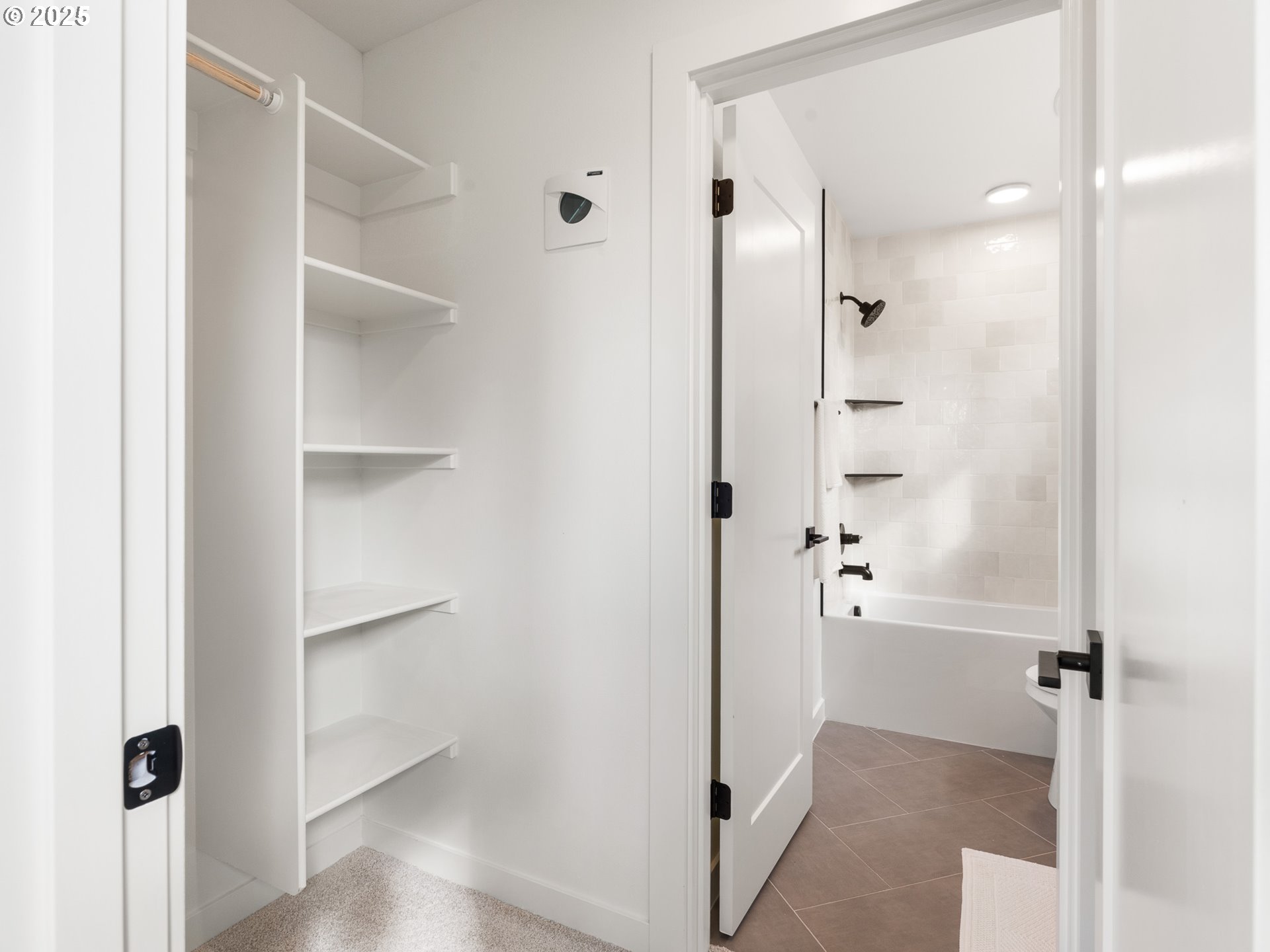 1911 Broadway Street, Unit 1 Vancouver, WA 98663 - Photo 22 of 25 a view of a bathroom with a glass shower door