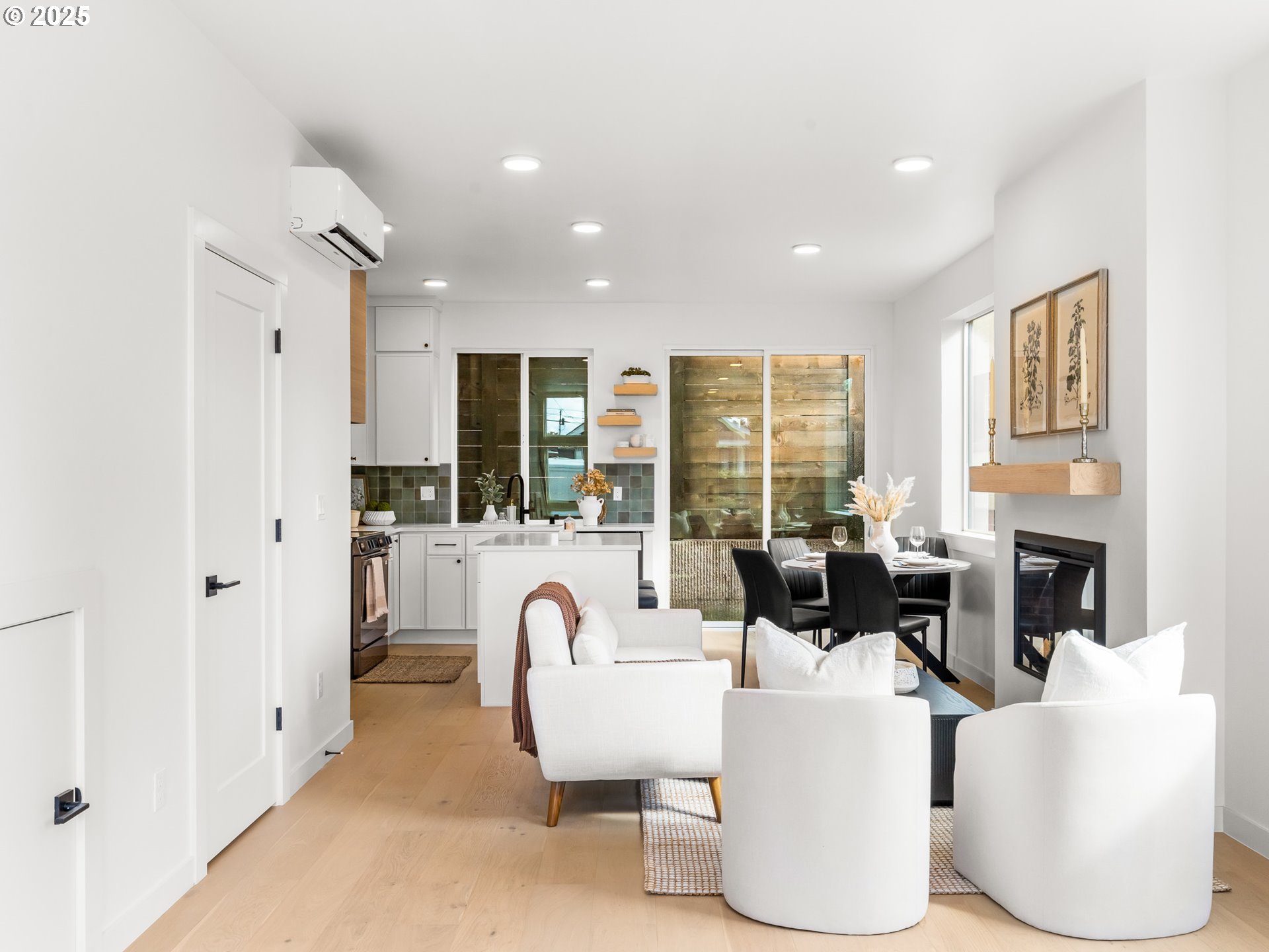 1911 Broadway Street, Unit 1 Vancouver, WA 98663 - Photo 8 of 25 a living room with fireplace furniture and a large window