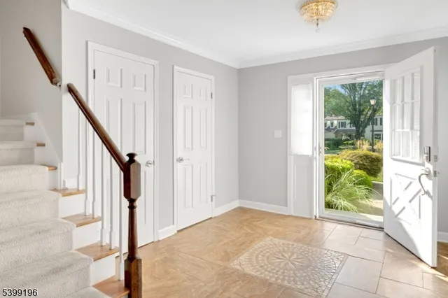 a kitchen with stainless steel appliances granite countertop a sink stove refrigerator and cabinets