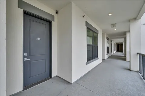 a view of a hallway with some storage and utility room