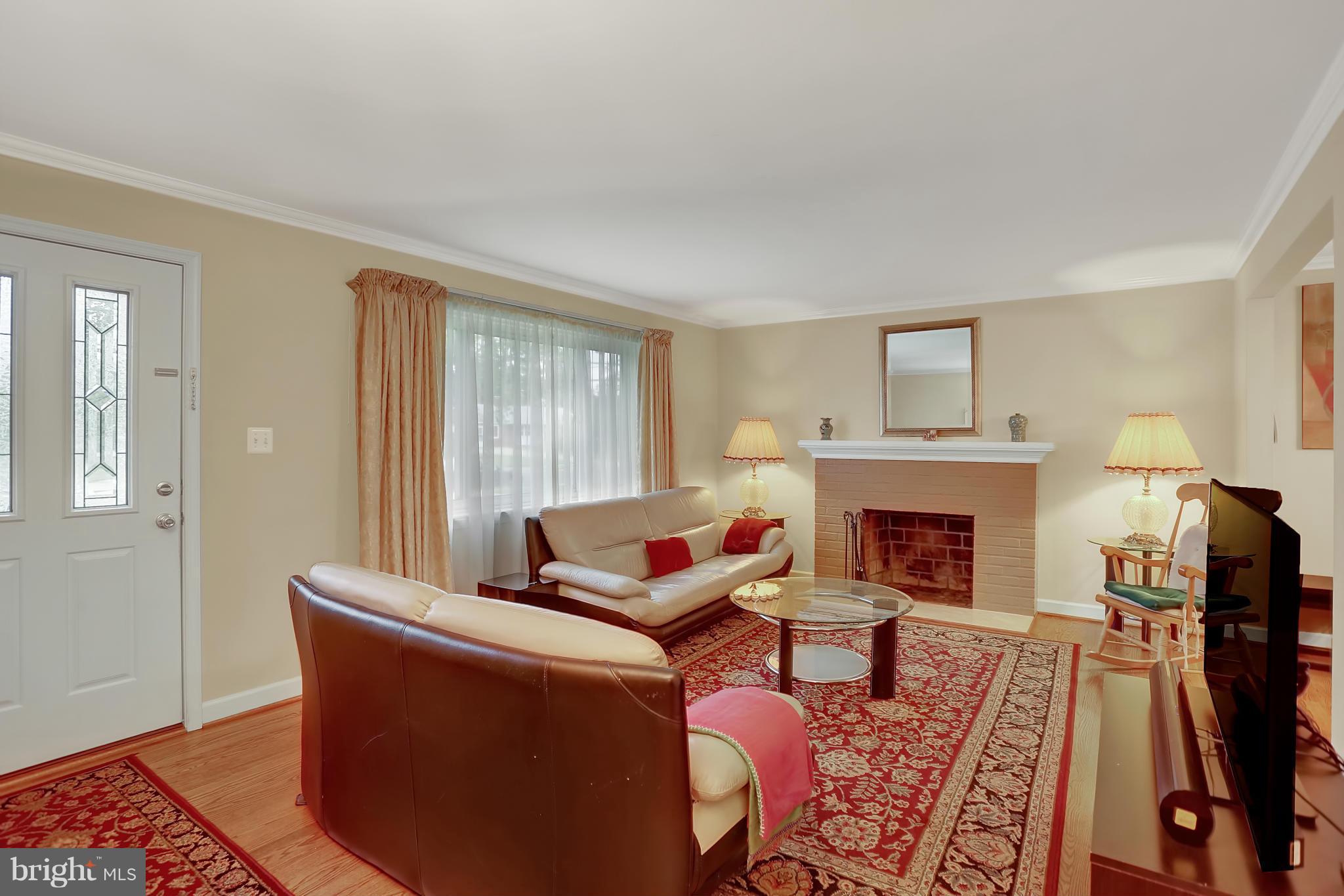 6217 Hanover Avenue Springfield, VA 22150 - Photo 4 of 30 Spacious living room with wood-burning FP