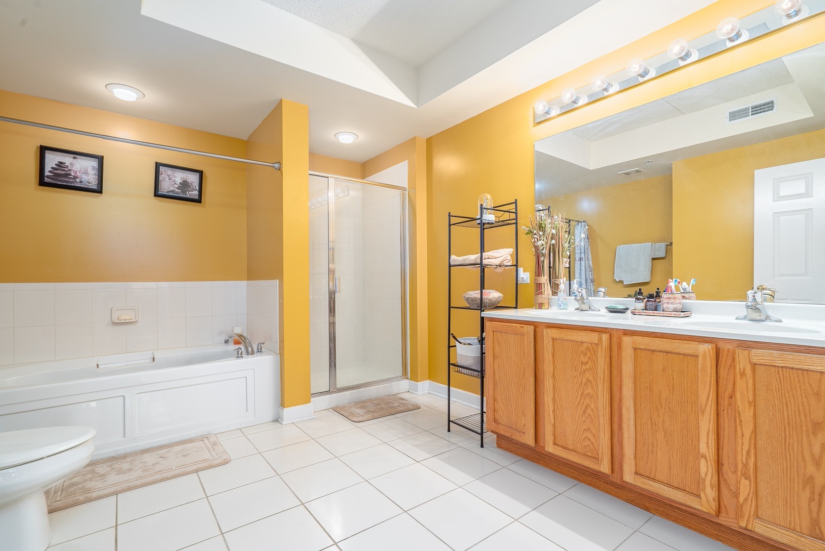 77 North Wolf Road, Unit 507 Northlake, IL 60164 - Photo 11 of 15 a bathroom with a sink a toilet and shower