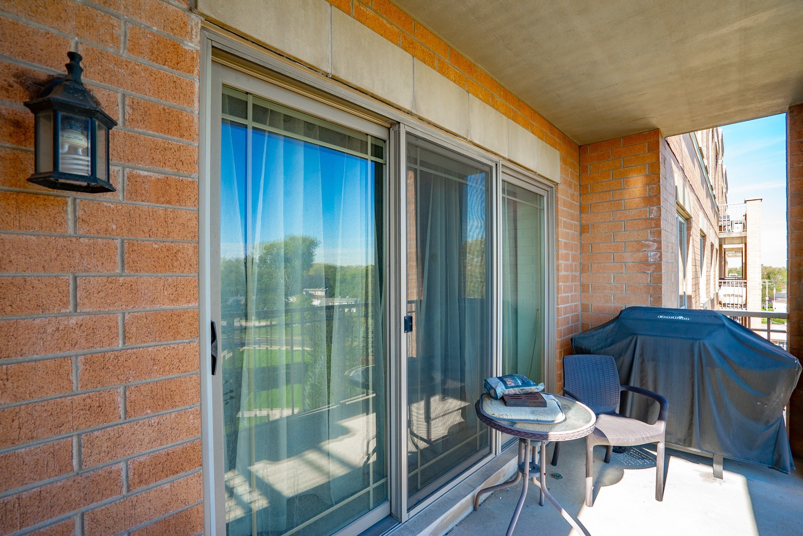 77 North Wolf Road, Unit 507 Northlake, IL 60164 - Photo 7 of 15 a view of a balcony with furniture and next to a window