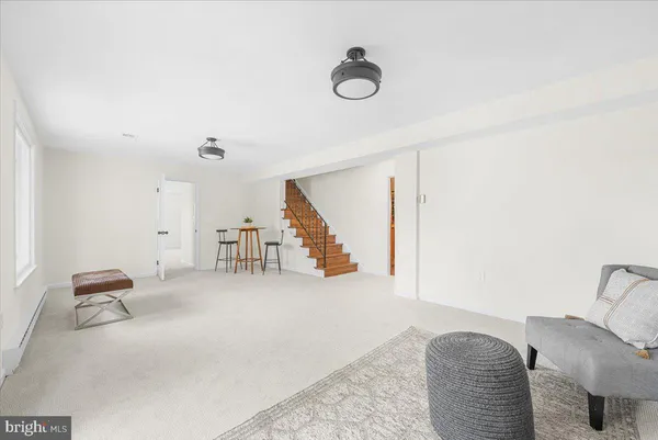 a view of livingroom with furniture and stairs