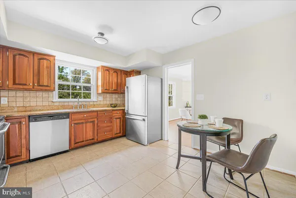 a kitchen with sink cabinets and window