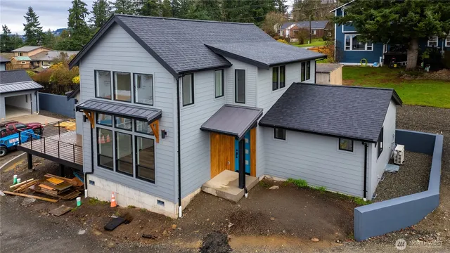 a kitchen with a stove and a large window