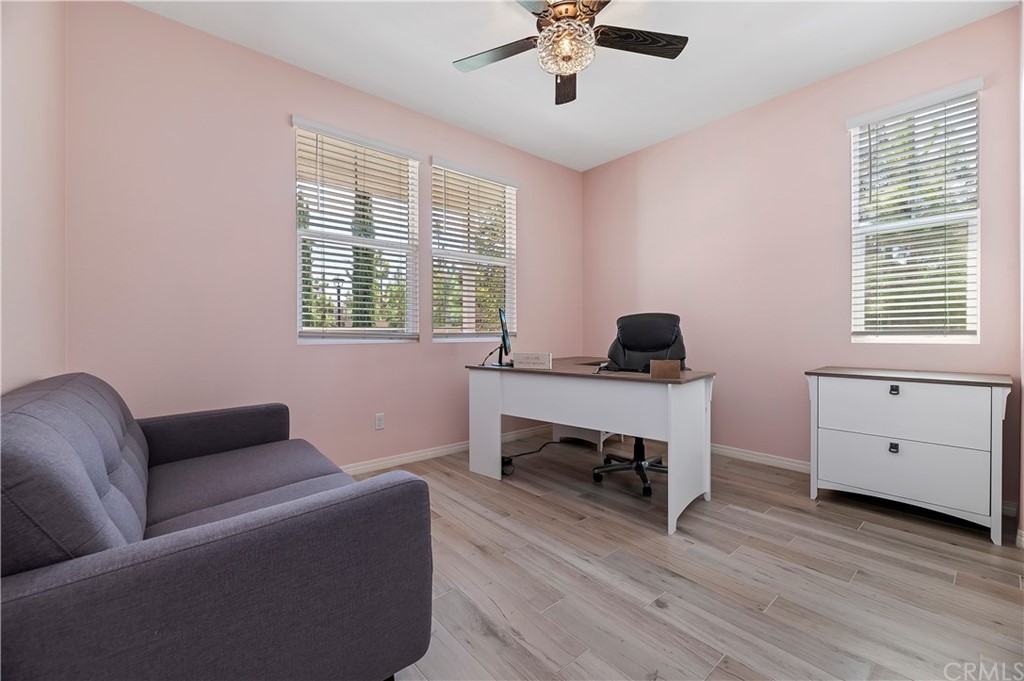14557 Sienna Place Eastvale, CA 92880 - Photo 18 of 35 a living room with furniture and a window