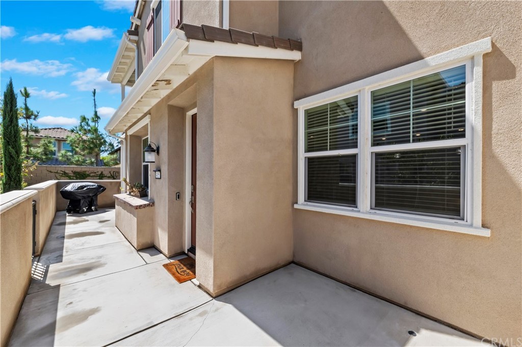 14557 Sienna Place Eastvale, CA 92880 - Photo 5 of 35 a view of a house with a large window