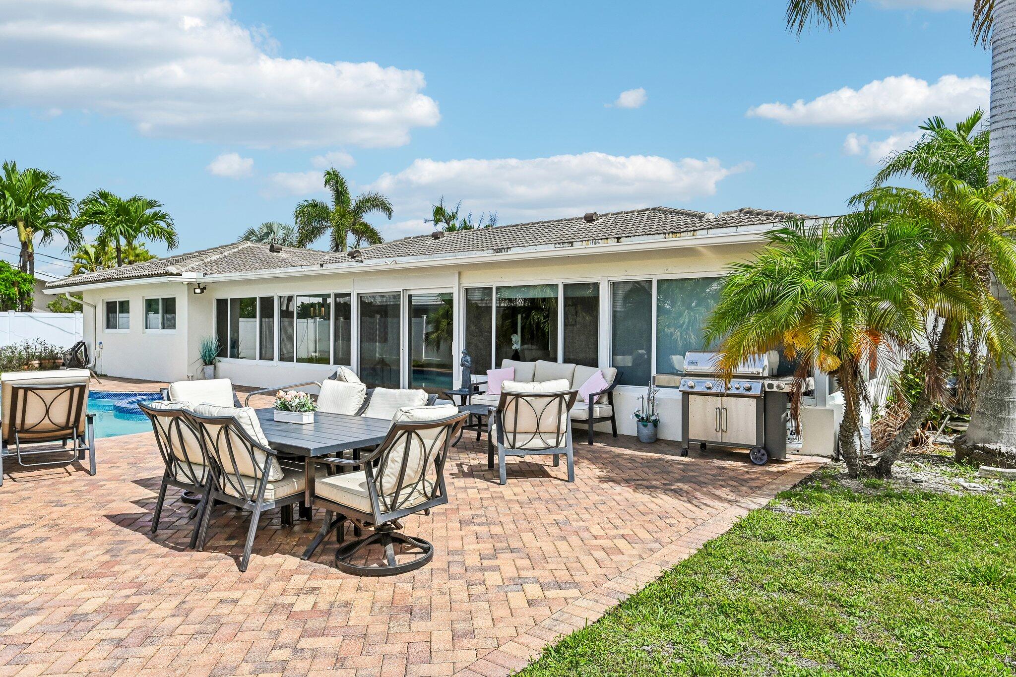 2940 Northeast 39th Court Lighthouse Point, FL 33064 - Photo 31 of 42 a view of a house with patio