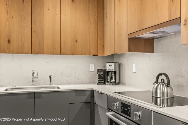 a kitchen with a sink and cabinets