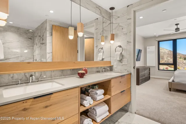 a large bathroom with a large tub and sink