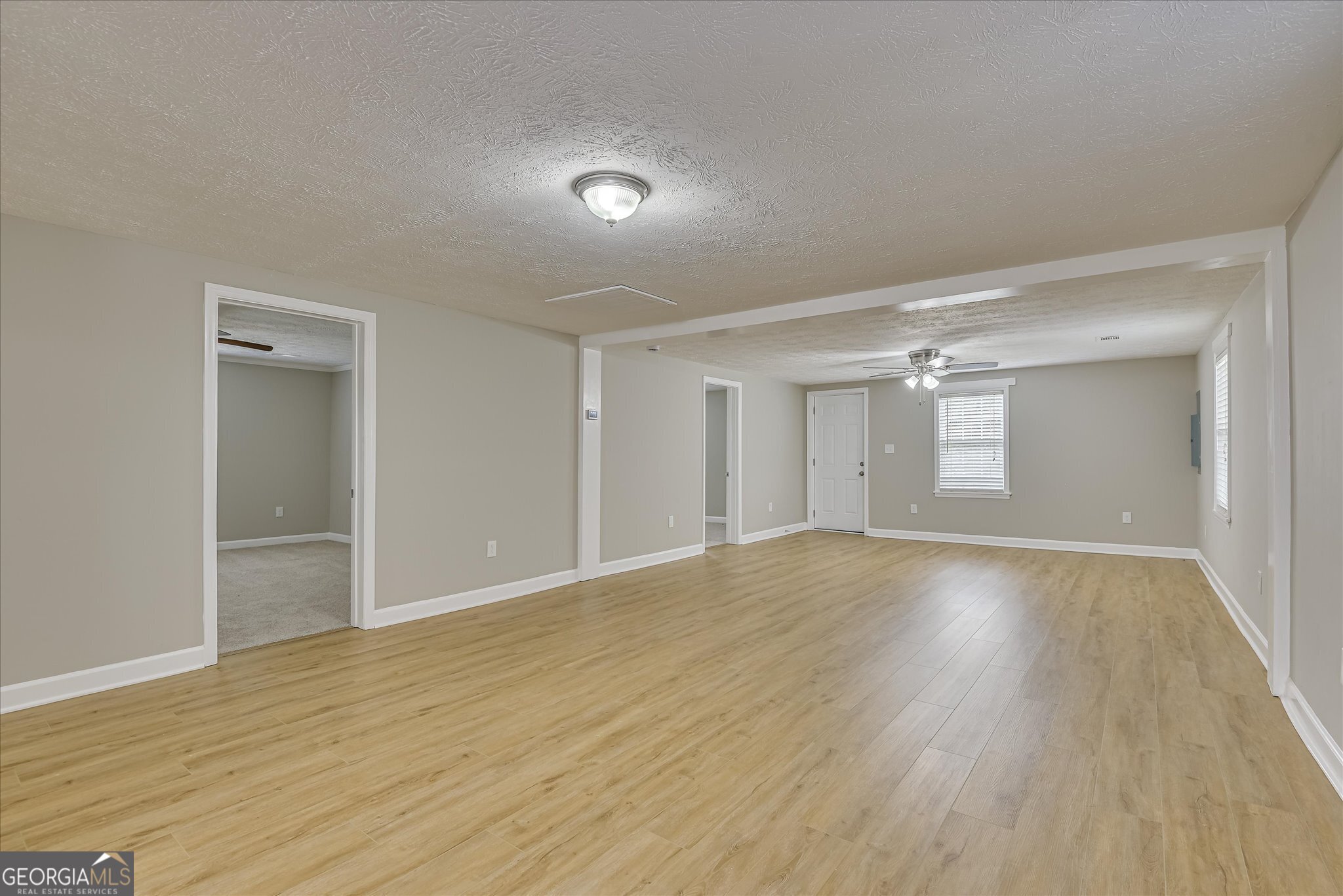 1321 Brett Road Wadley, GA 30477 - Photo 12 of 47 a view of empty room with wooden floor and fan
