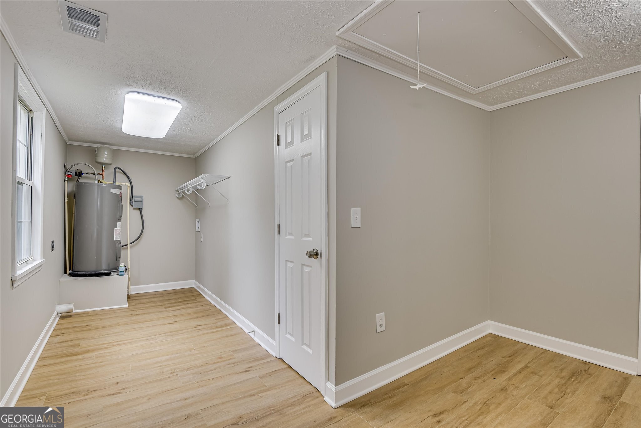 1321 Brett Road Wadley, GA 30477 - Photo 36 of 47 a view of a room with wooden floor and entryway