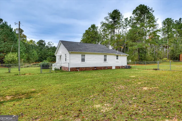 a view of a water fountain and a bench