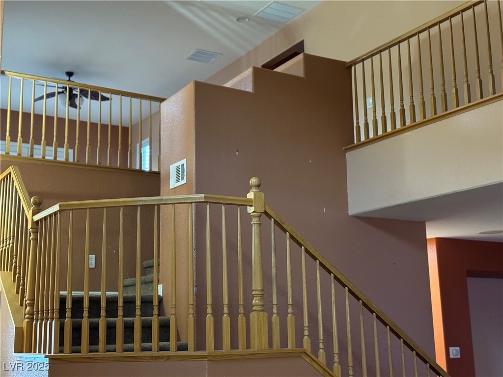 9121 Rusty Rifle Avenue Las Vegas, NV 89143 - Photo 3 of 5 Stairway featuring a ceiling fan