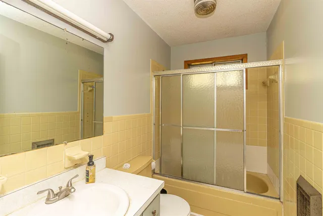 a bathroom with a sink and shower