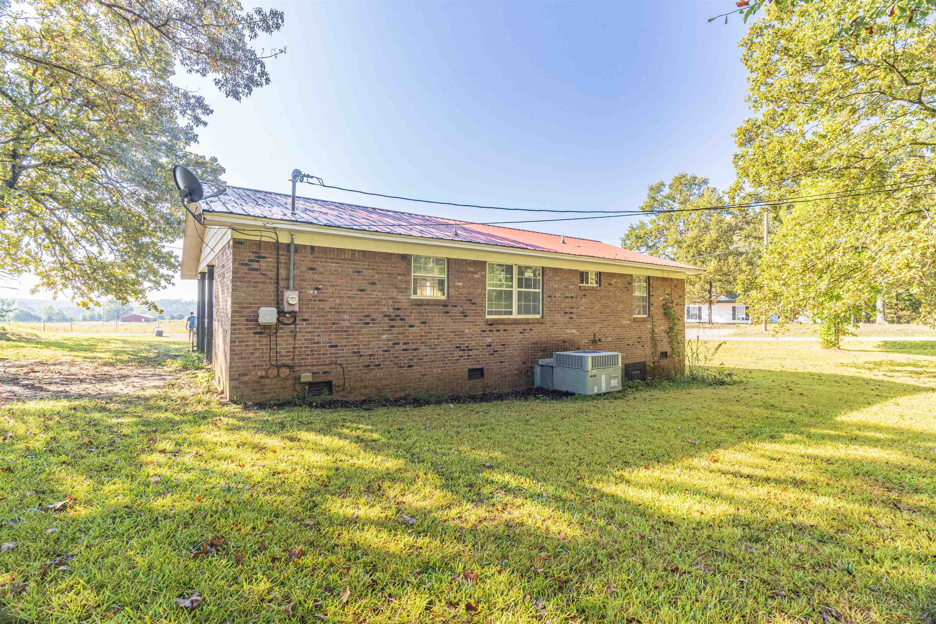 147 Jones Street Selmer, TN 38375 - Photo 5 of 19 a view of a house with a big yard